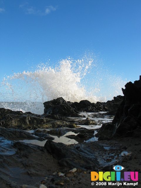 24247 Spray of waves splashing on rocks